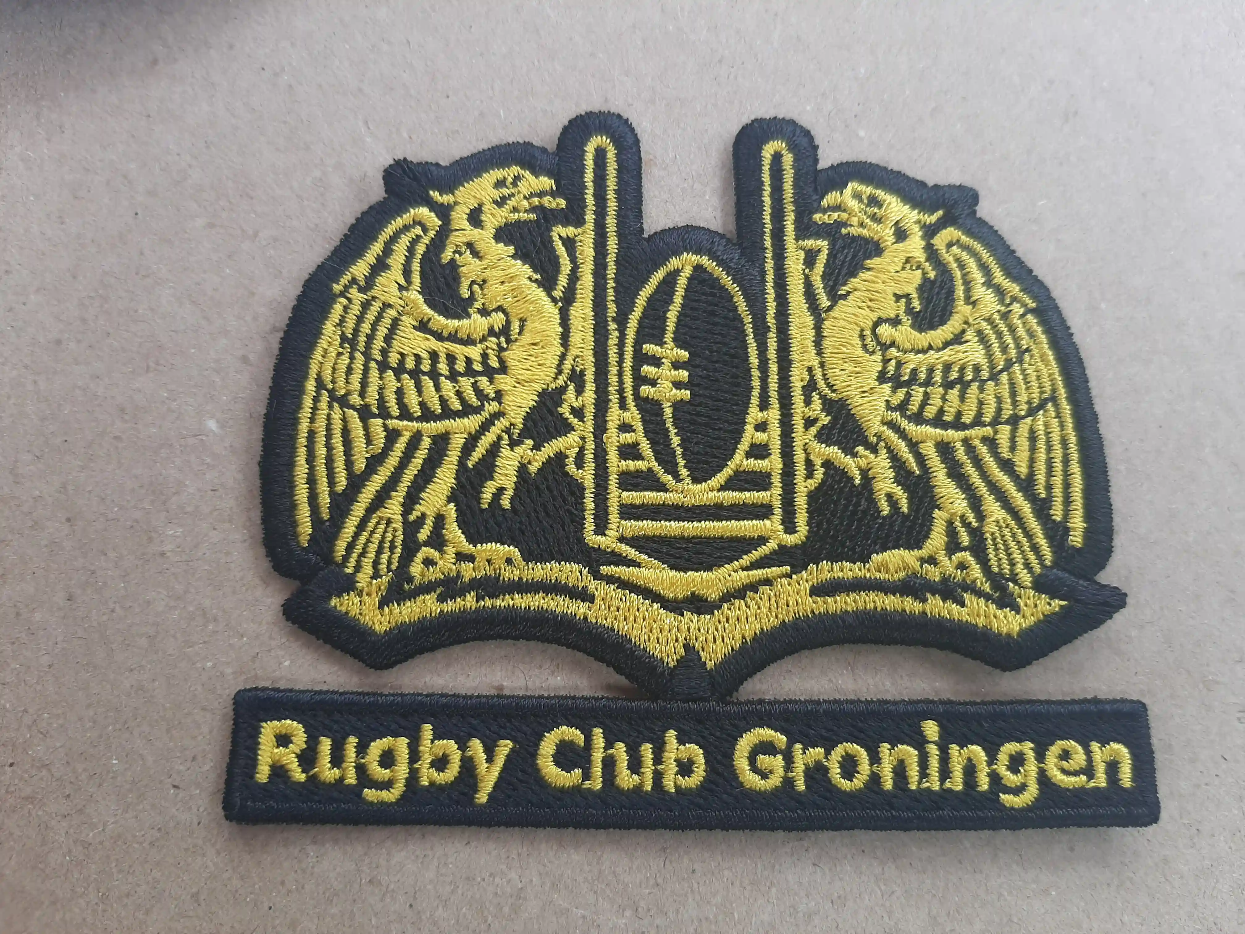 Crested Gryphins with the Rugby Icon in the middle is hand digitized and there is a reverse Applique aka negative space. Crisp quality in GOLD – Embroidered Patches
