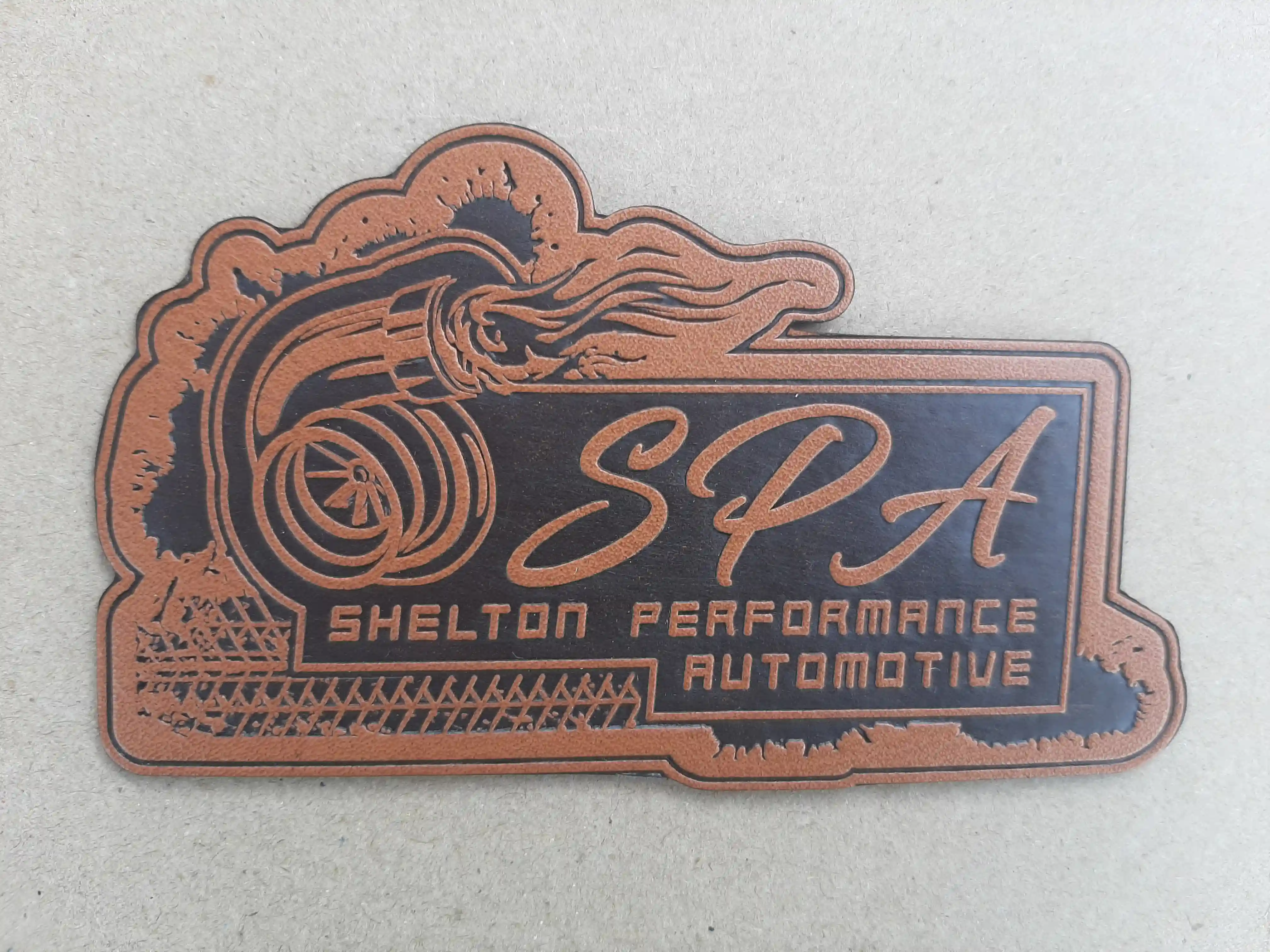 Blend of Sharp details and a distressed effect. In Chatham VA with the beautiful logo of wheels fiery exhaust – Leather Patches